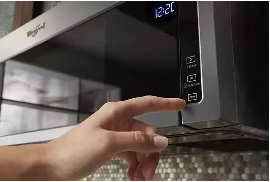 Why does my Whirlpool microwave fan keep running after cooking