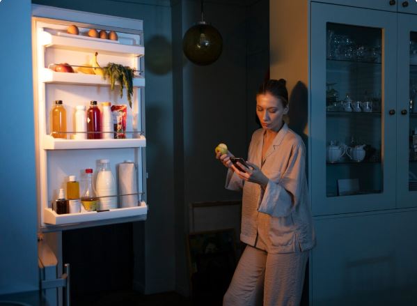 Is it normal for a GE refrigerator to hum loudly at night