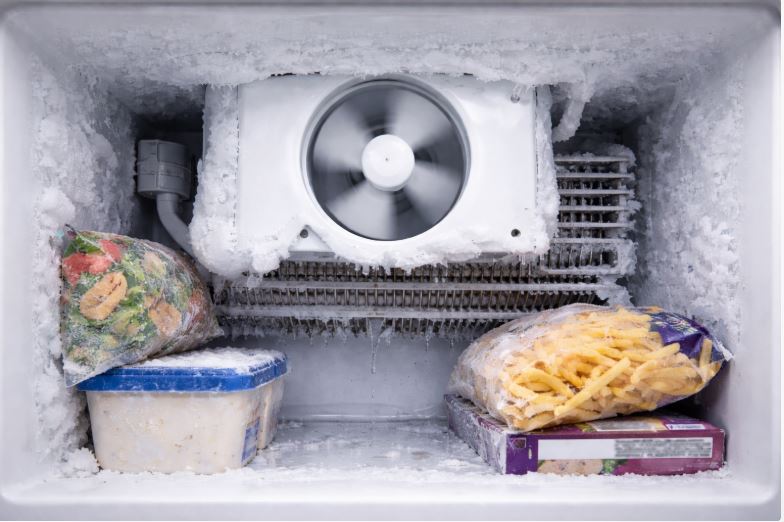 freezer fan running while frost buildup blocks cooling on the back wall